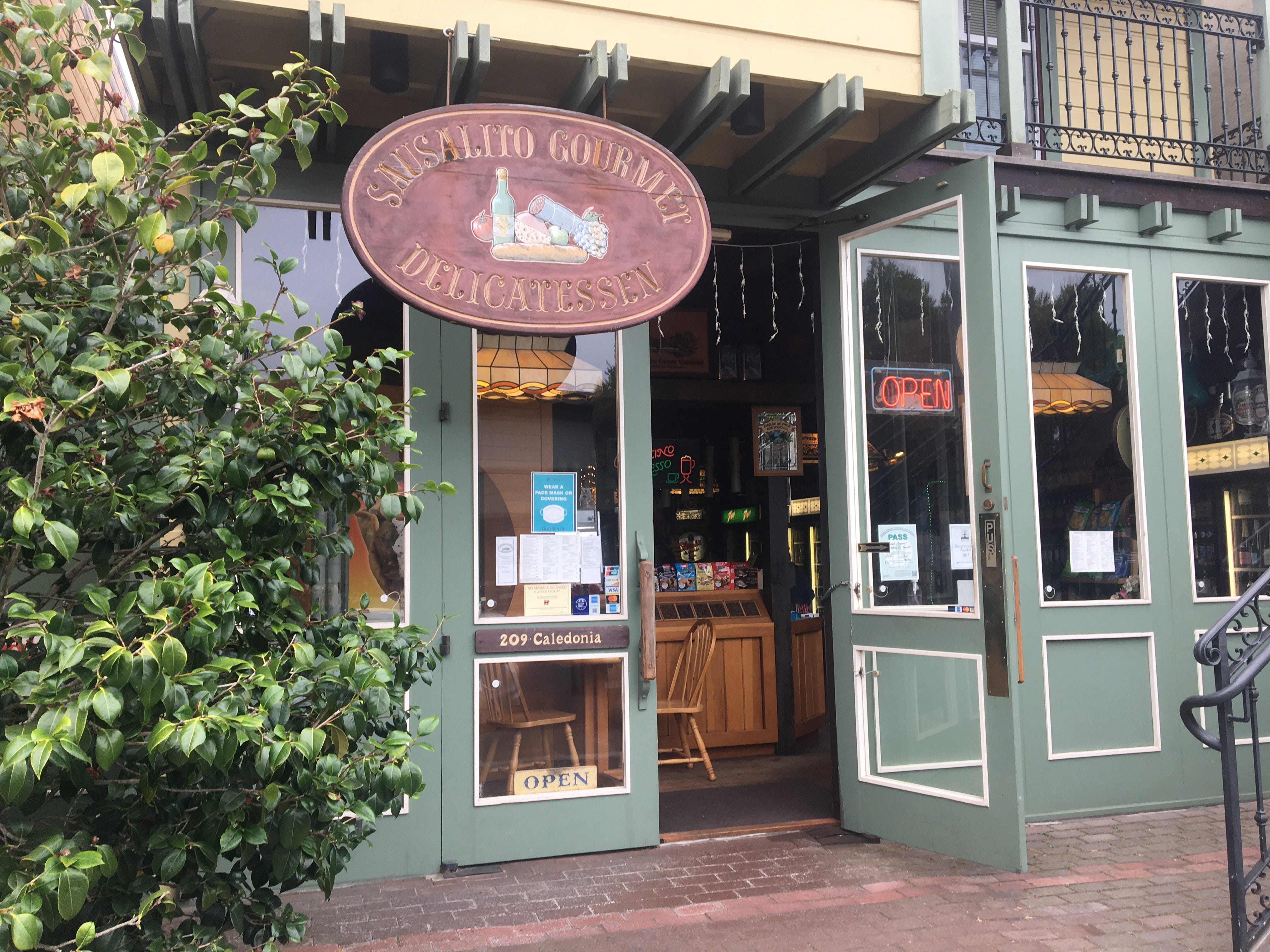 Sausalito Gourmet Delicatessen entrance and brick sidewalk